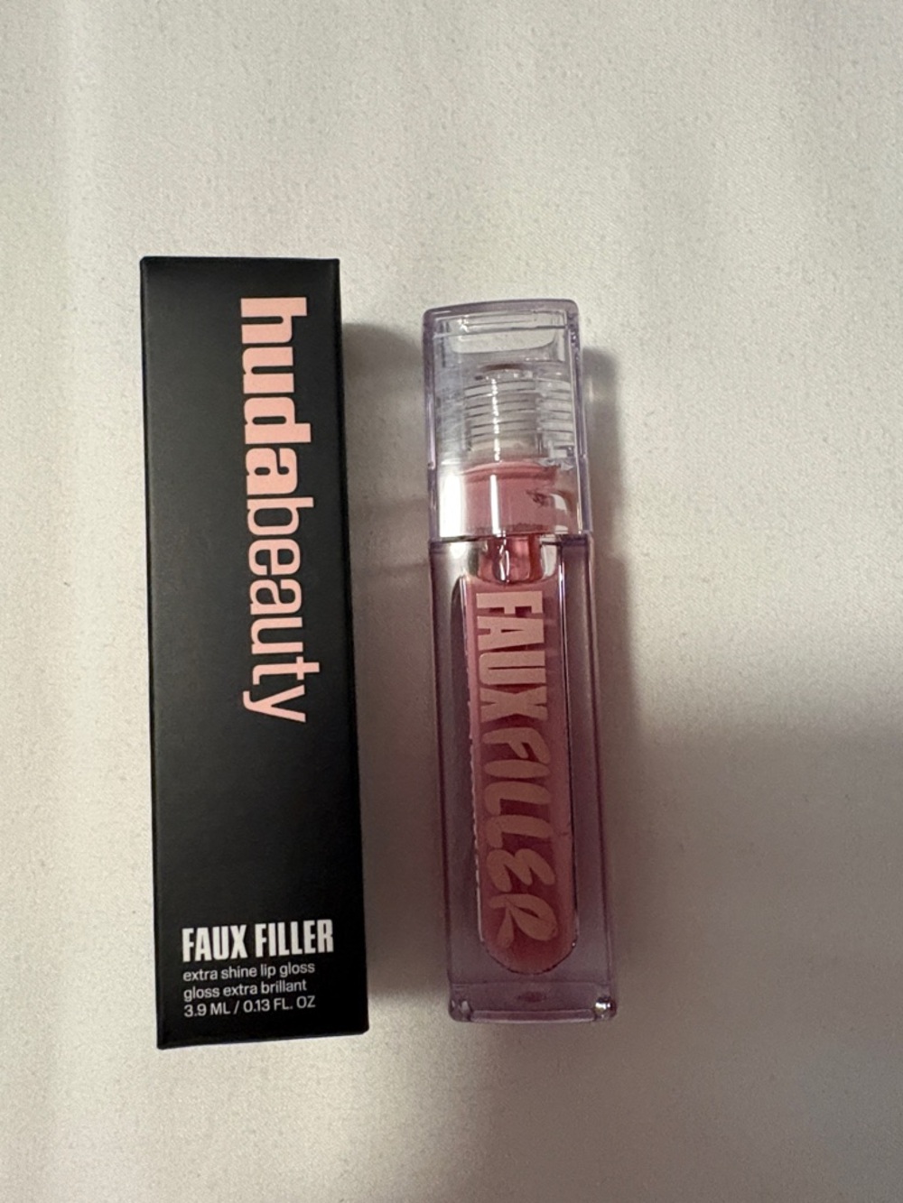 HUDA BEAUTY Faux Filler Lip Gloss – Sugar Baby - Soft Pink Shine